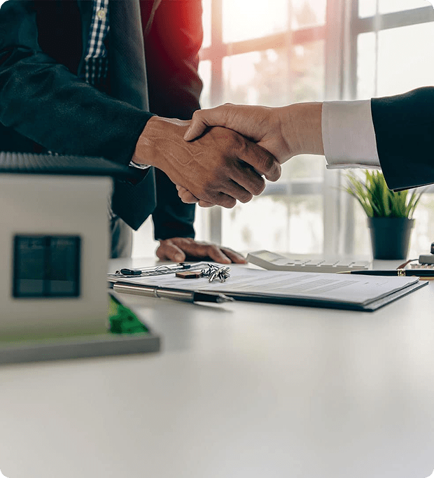 Home buyer and seller shaking hands during a property sale
