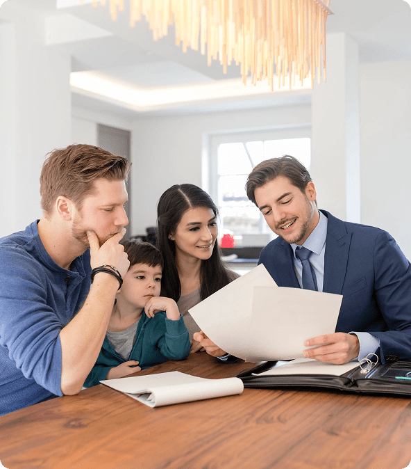 Family reviewing documents for a home purchase