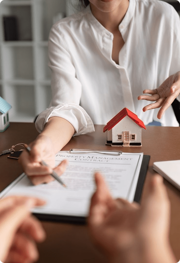 Home sale documents with a model house