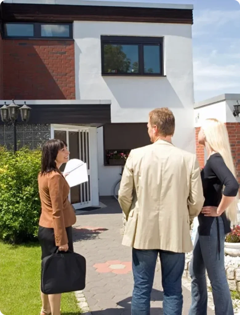 Homeowners discussing a house sale with a buyer